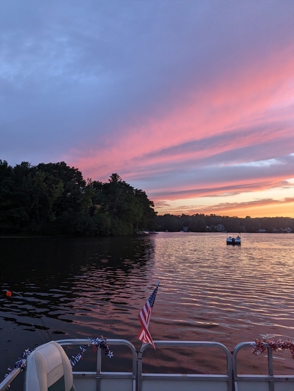 14 Elizabeth Street Dudley, MA 01571 - Photo 32 of 37 a view of a lake with sunset