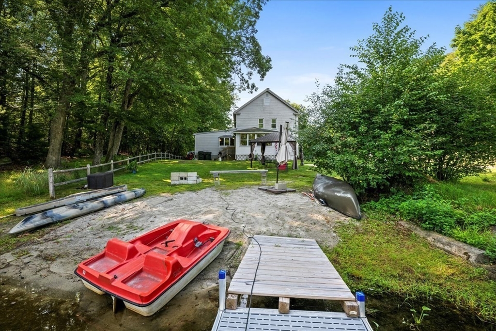 14 Elizabeth Street Dudley, MA 01571 - Photo 33 of 37 a view of a backyard with plants and a patio