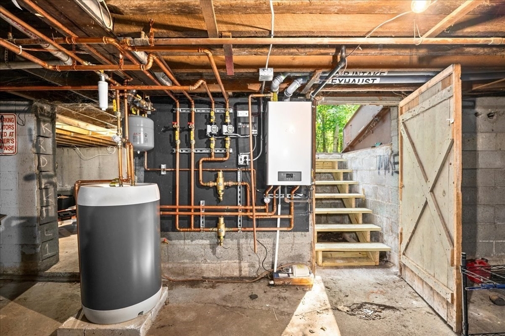 14 Elizabeth Street Dudley, MA 01571 - Photo 35 of 37 a view of a patio with table and chairs