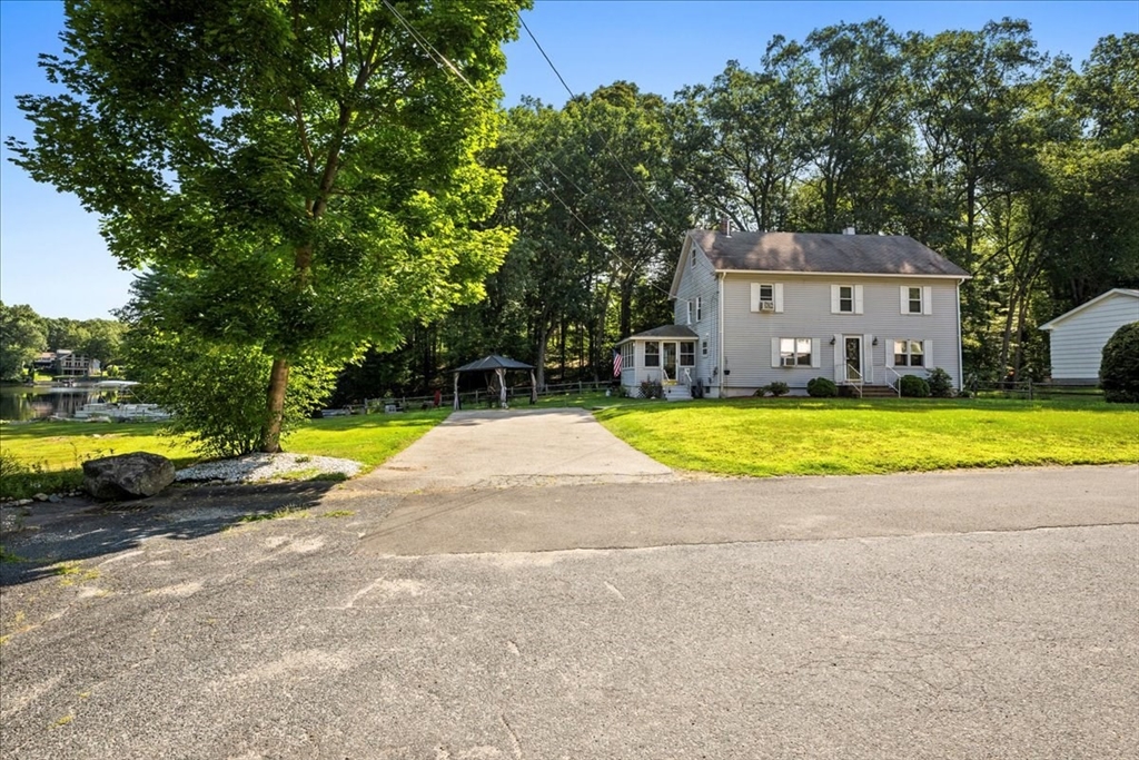 14 Elizabeth Street Dudley, MA 01571 - Photo 37 of 37 a view of swimming pool with lawn chairs and large trees