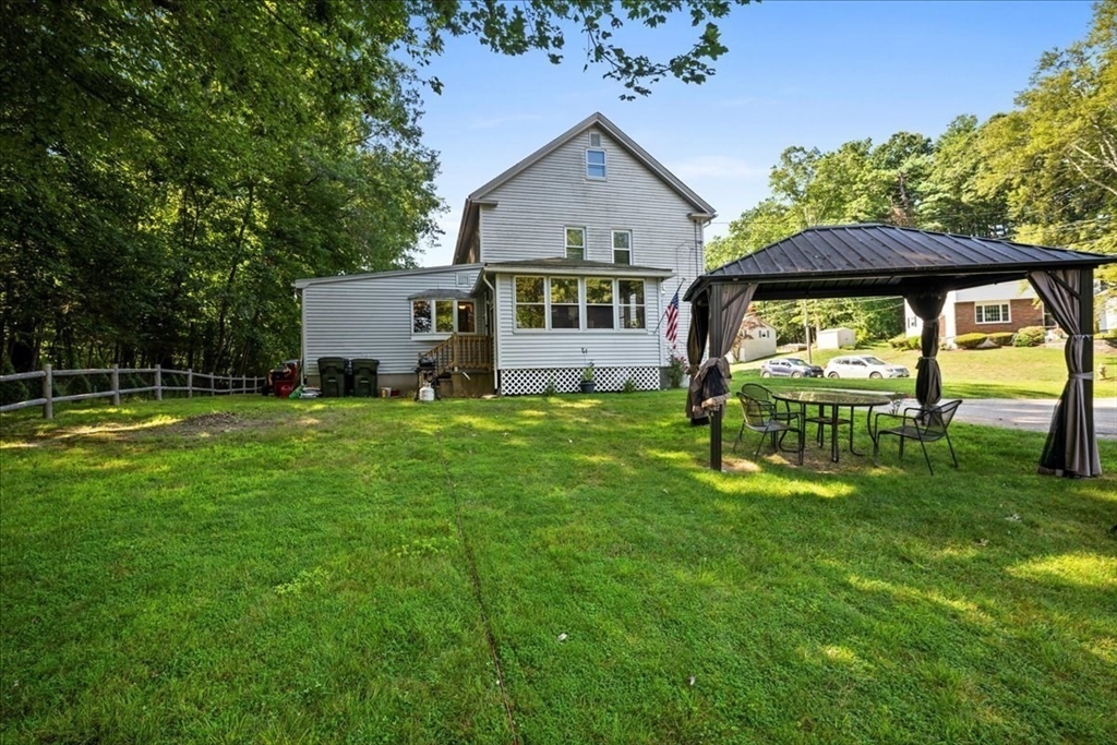 14 Elizabeth Street Dudley, MA 01571 - Photo 4 of 37 a view of a house with backyard and sitting area
