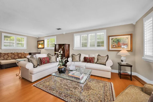 a living room with furniture rug and window