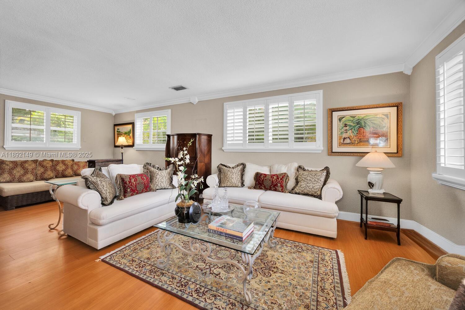 825 El Rado Street Coral Gables, FL 33134 - Photo 4 of 40 a living room with furniture rug and window