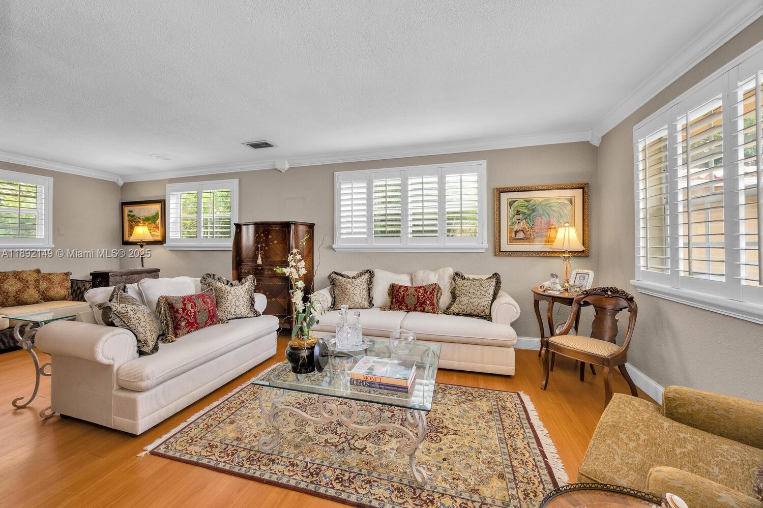 825 El Rado Street Coral Gables, FL 33134 - Photo 5 of 40 a living room with furniture and a large window