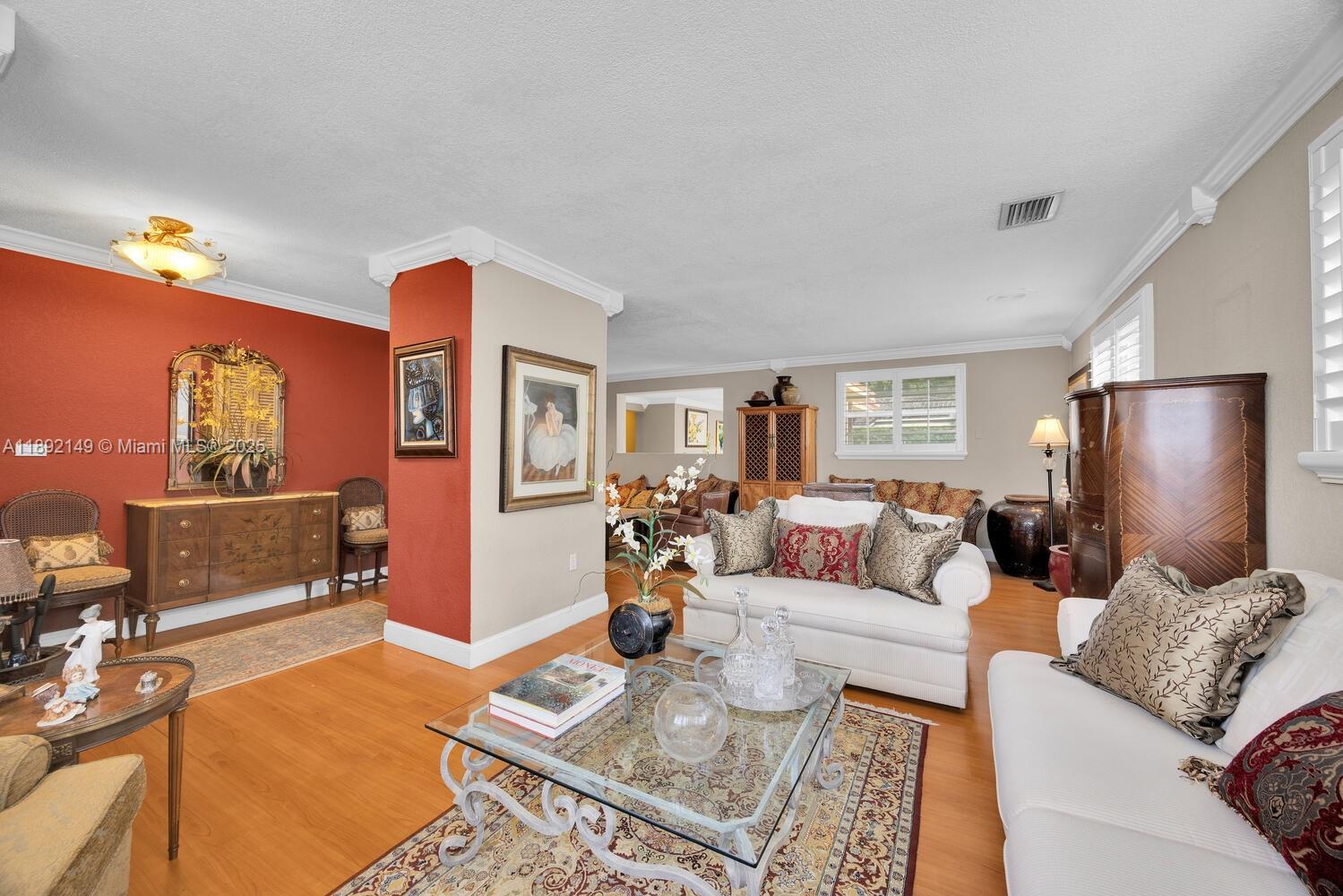 825 El Rado Street Coral Gables, FL 33134 - Photo 6 of 40 a living room with furniture and wooden floor