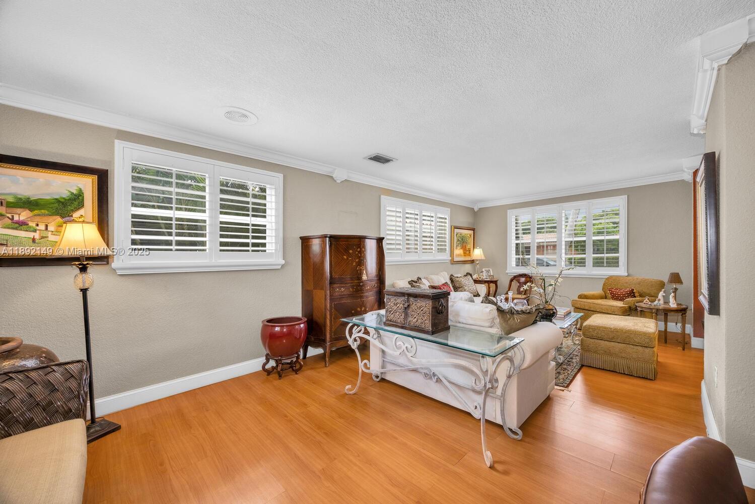 825 El Rado Street Coral Gables, FL 33134 - Photo 7 of 40 a living room with furniture window and a flat screen tv