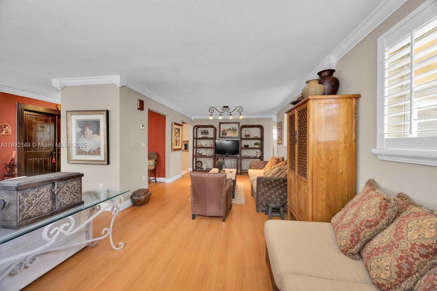 825 El Rado Street Coral Gables, FL 33134 - Photo 9 of 40 a living room with furniture and a flat screen tv