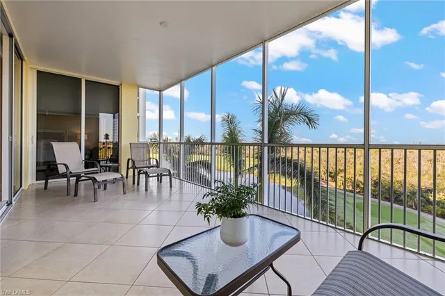 a lobby with furniture and floor to ceiling window