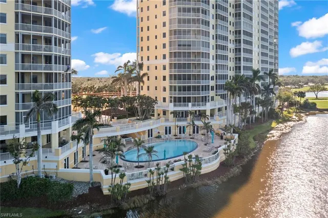 a balcony with table and chairs