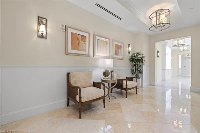 a view of a livingroom with furniture and a window