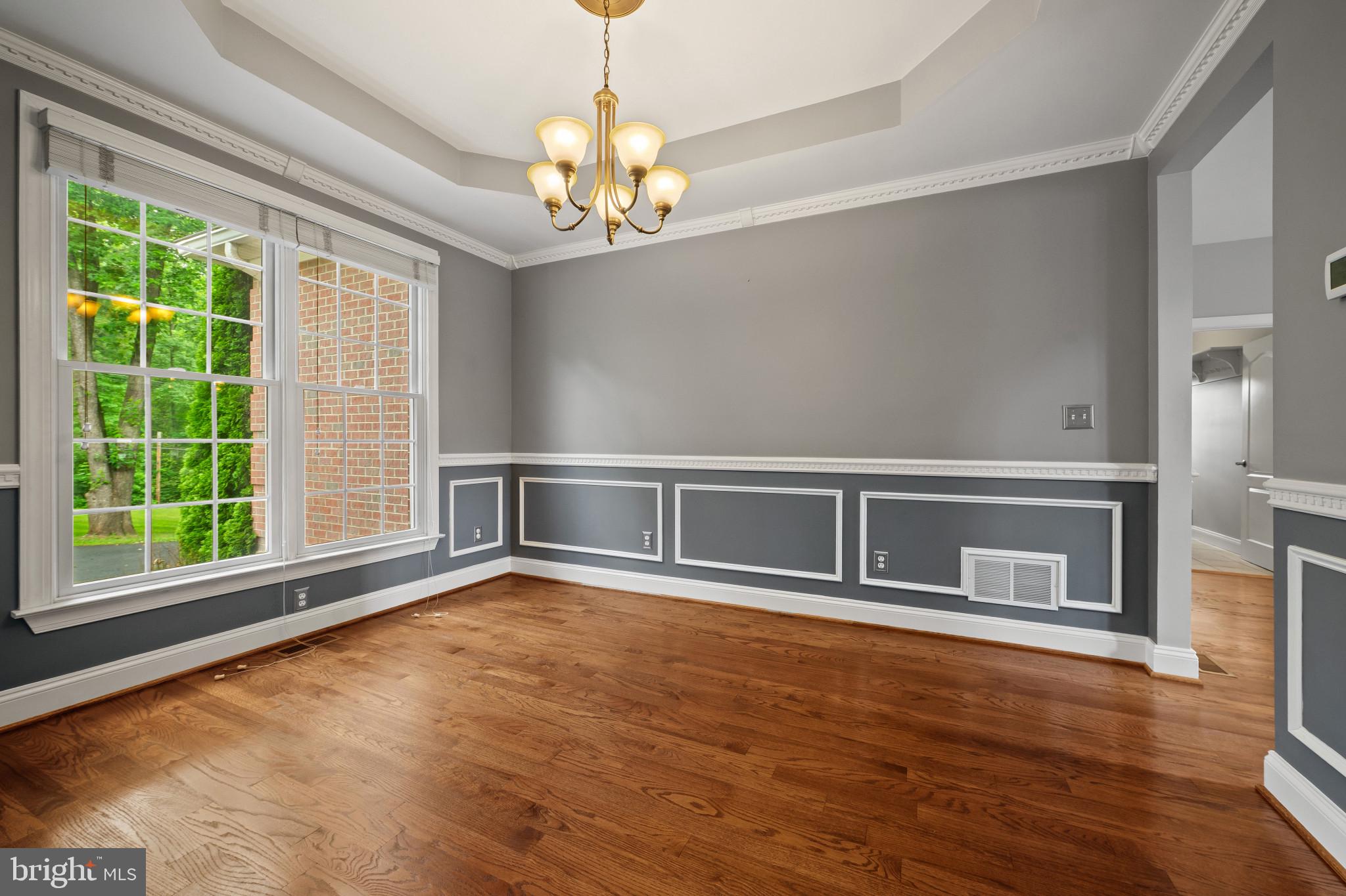 12221 Jerusalem Road Kingsville, MD 21087 - Photo 13 of 66 a view of an empty room with wooden floor and a window
