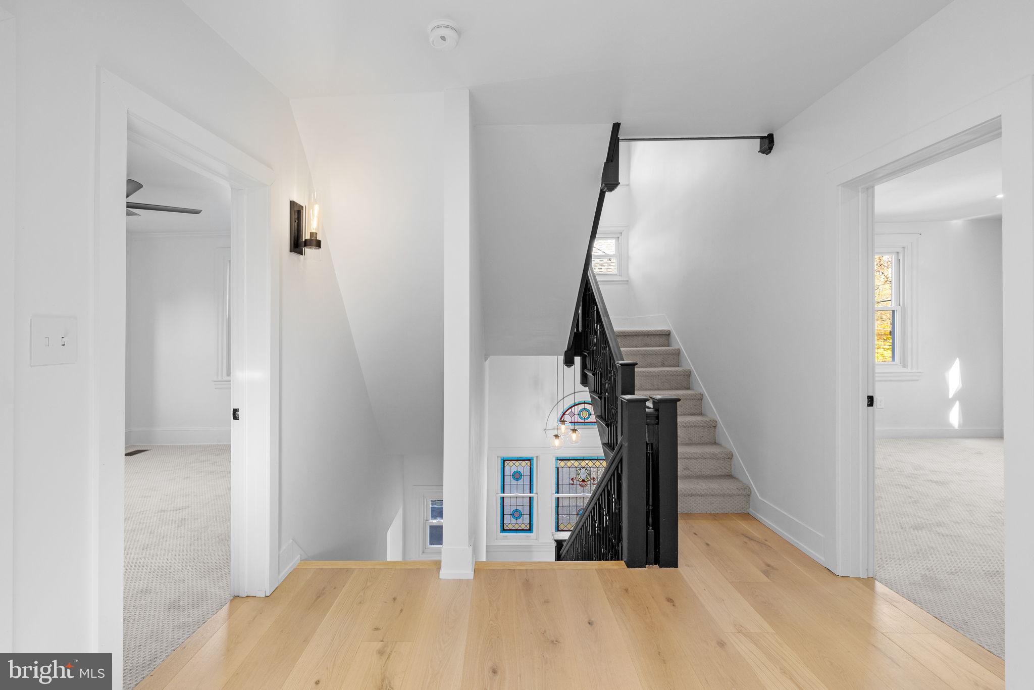 222 Church Road Ardmore, PA 19003 - Photo 38 of 69 a view of a livingroom with wooden floor and stairs