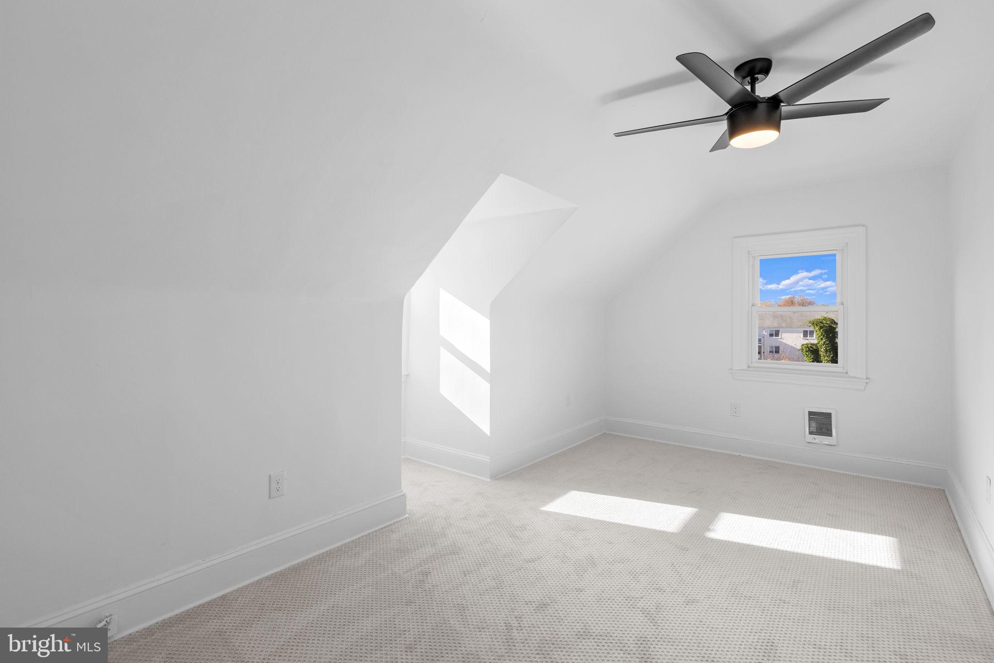 222 Church Road Ardmore, PA 19003 - Photo 54 of 69 an empty room with windows and ceiling fan
