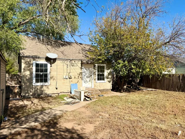 a view of a house with snow in the yard