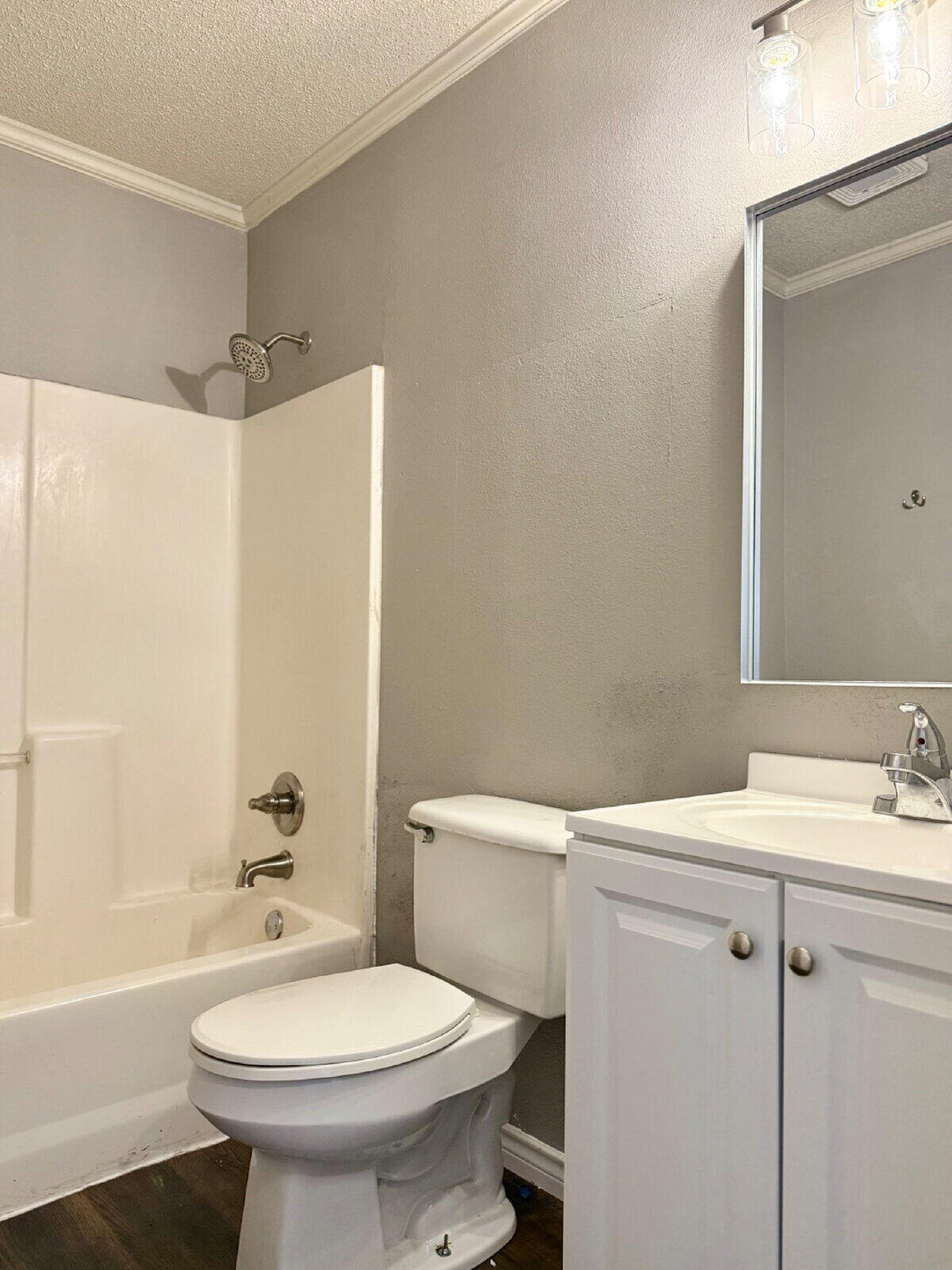 2423 25th Street Lubbock, TX 79411 - Photo 9 of 14 a bathroom with a sink a toilet and shower