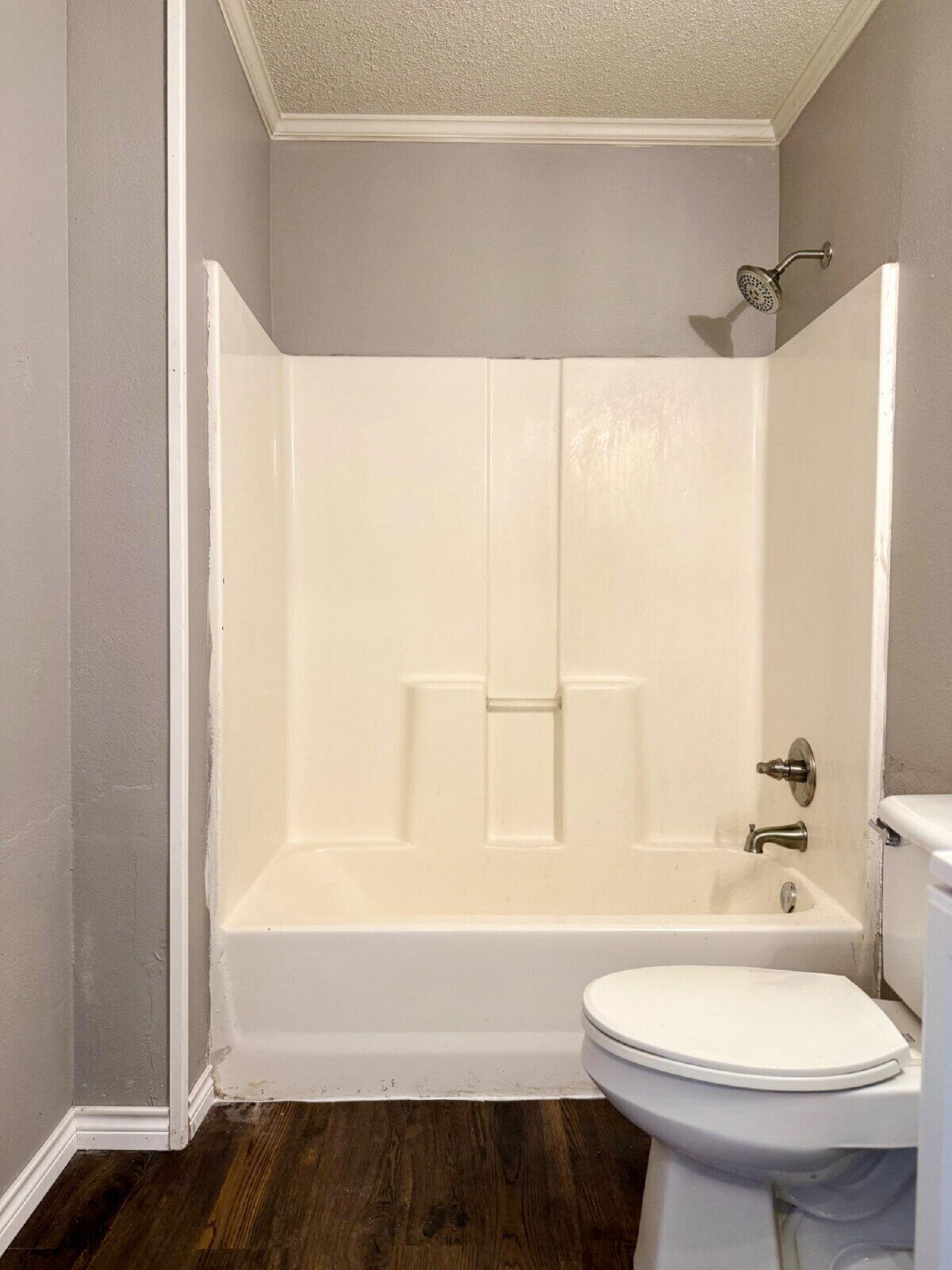 2423 25th Street Lubbock, TX 79411 - Photo 10 of 14 a bathroom with a sink and a mirror