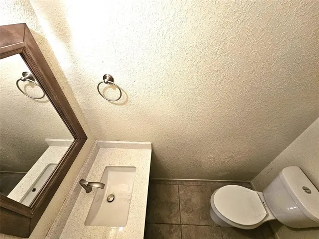 a bathroom with a sink a mirror and vanity