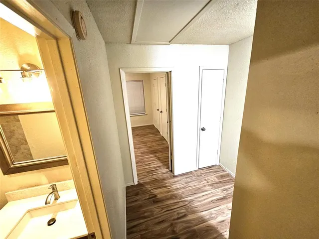 a tall building with a small yard