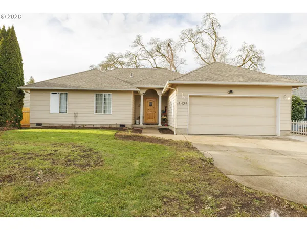 a front view of a house with yard