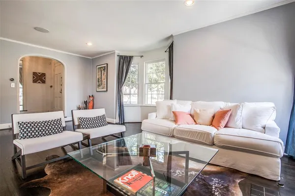 a living room with furniture and a rug