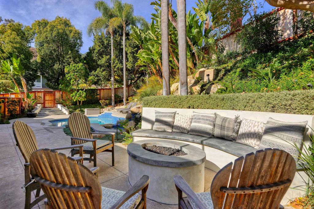 1739 Sienna Canyon Drive Encinitas, CA 92024 - Photo 11 of 29 a view of a patio with couches table and chairs and potted plants