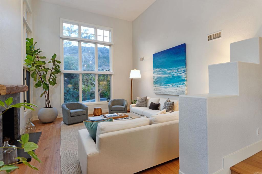 1739 Sienna Canyon Drive Encinitas, CA 92024 - Photo 16 of 29 a living room with furniture and a large window