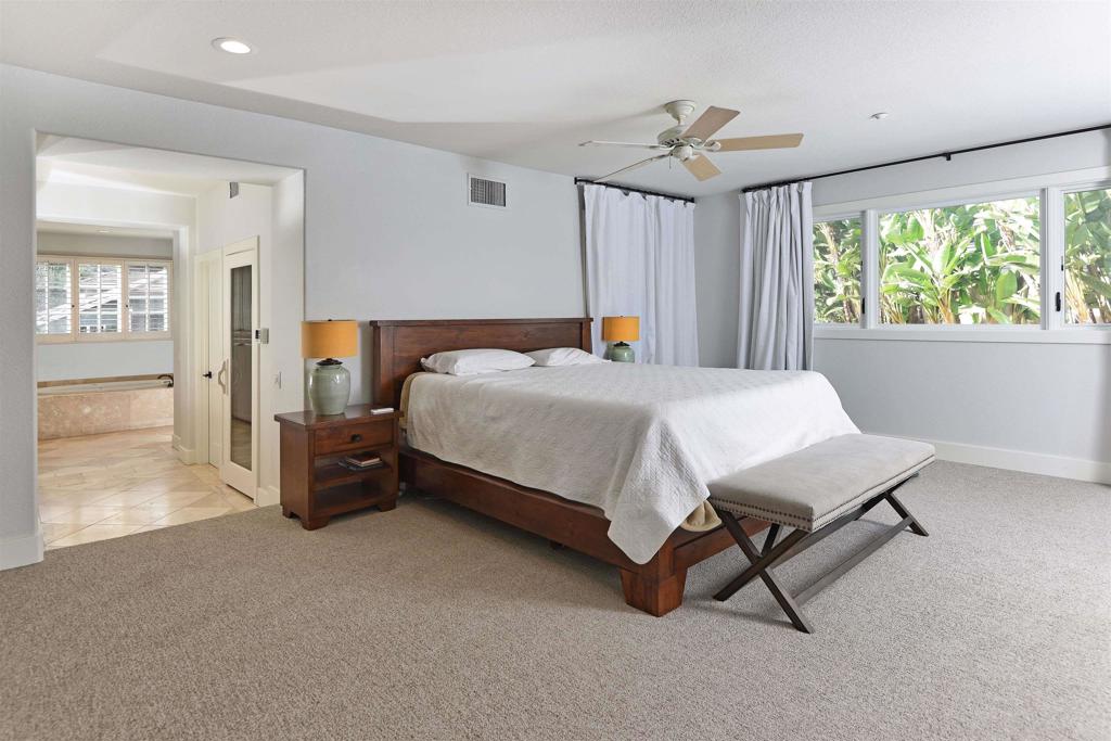 1739 Sienna Canyon Drive Encinitas, CA 92024 - Photo 18 of 29 a bedroom with a bed and a cabinets