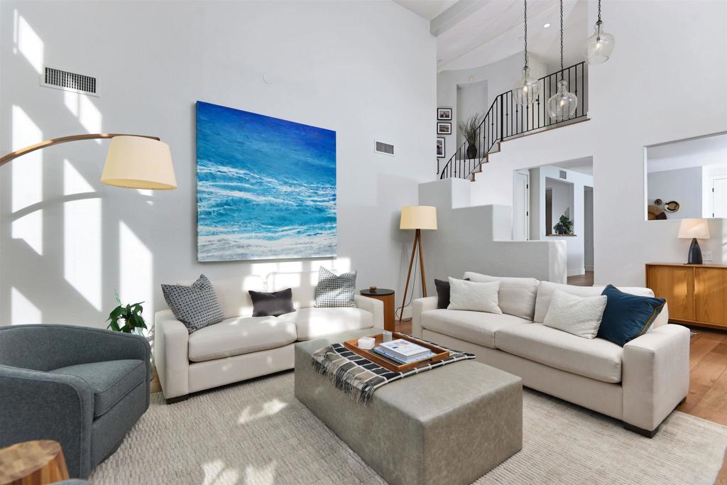 1739 Sienna Canyon Drive Encinitas, CA 92024 - Photo 6 of 29 a living room with furniture a rug kitchen view and a window