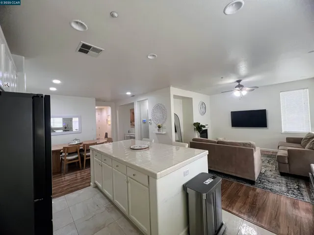 a kitchen with a sink microwave and refrigerator
