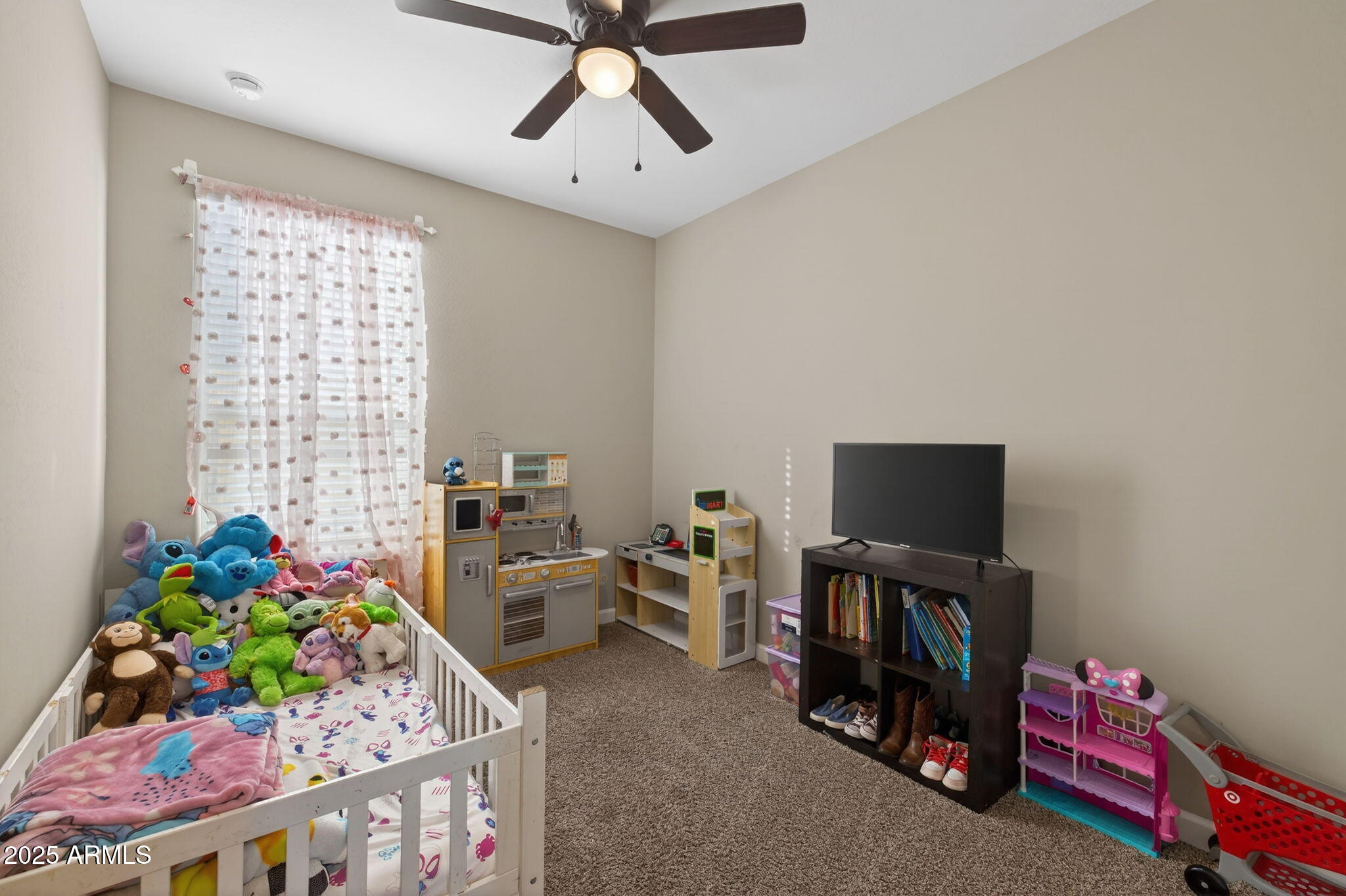 8269 West Rushmore Way Florence, AZ 85132 - Photo 19 of 27 a living room with furniture and a flat screen tv