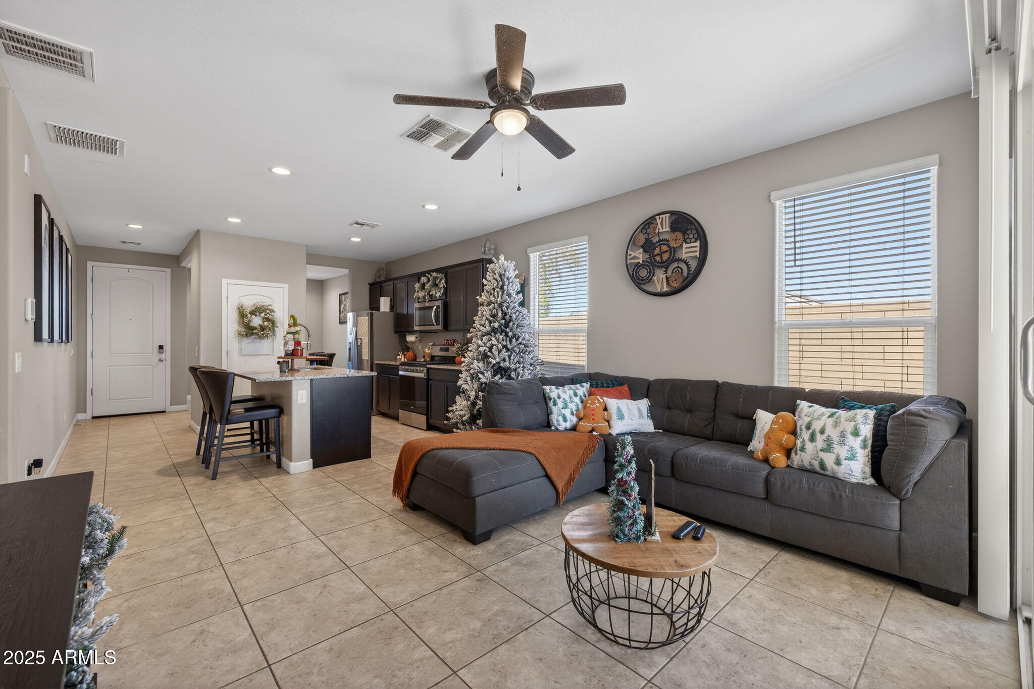 8269 West Rushmore Way Florence, AZ 85132 - Photo 5 of 27 a living room with furniture and a window