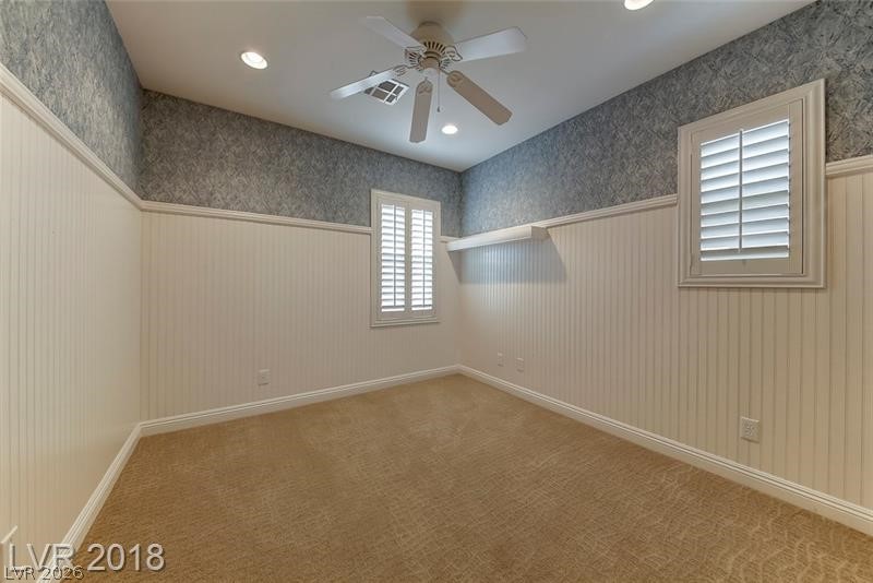 3144 Whitfeild Avenue Henderson, NV 89044 - Photo 27 of 55 Well-lit sleeping quarters with recessed lights and a ceiling fan provide a peaceful retreat.