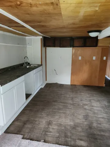 a kitchen with a sink and cabinets