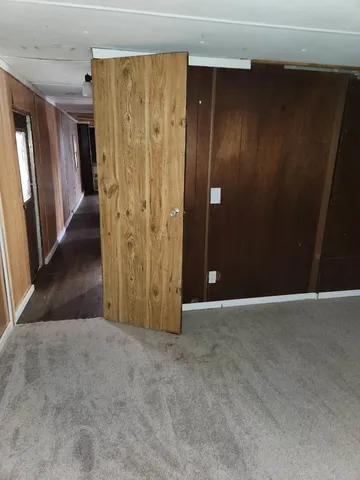an empty room with wooden door