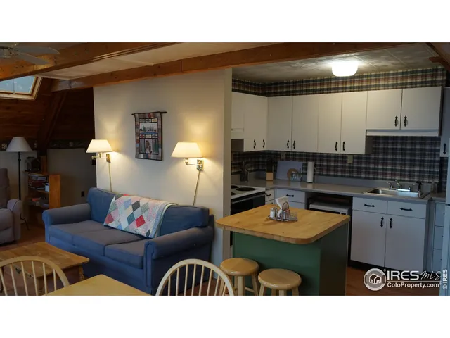 a kitchen with a wooden floor