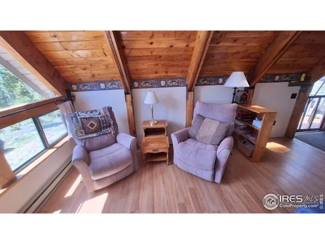 a black and white photo of a living room