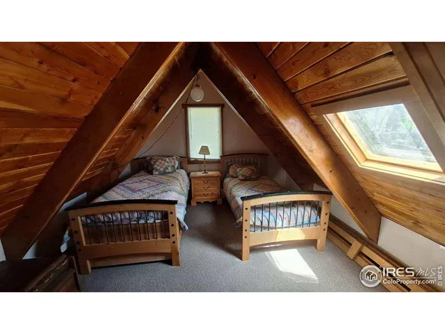 a upper view of a living room and dining room with a sink