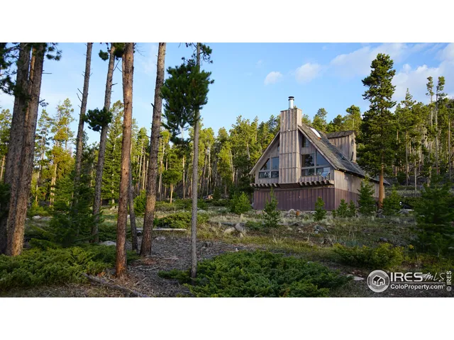 a balcony with a view of outdoor space and trees