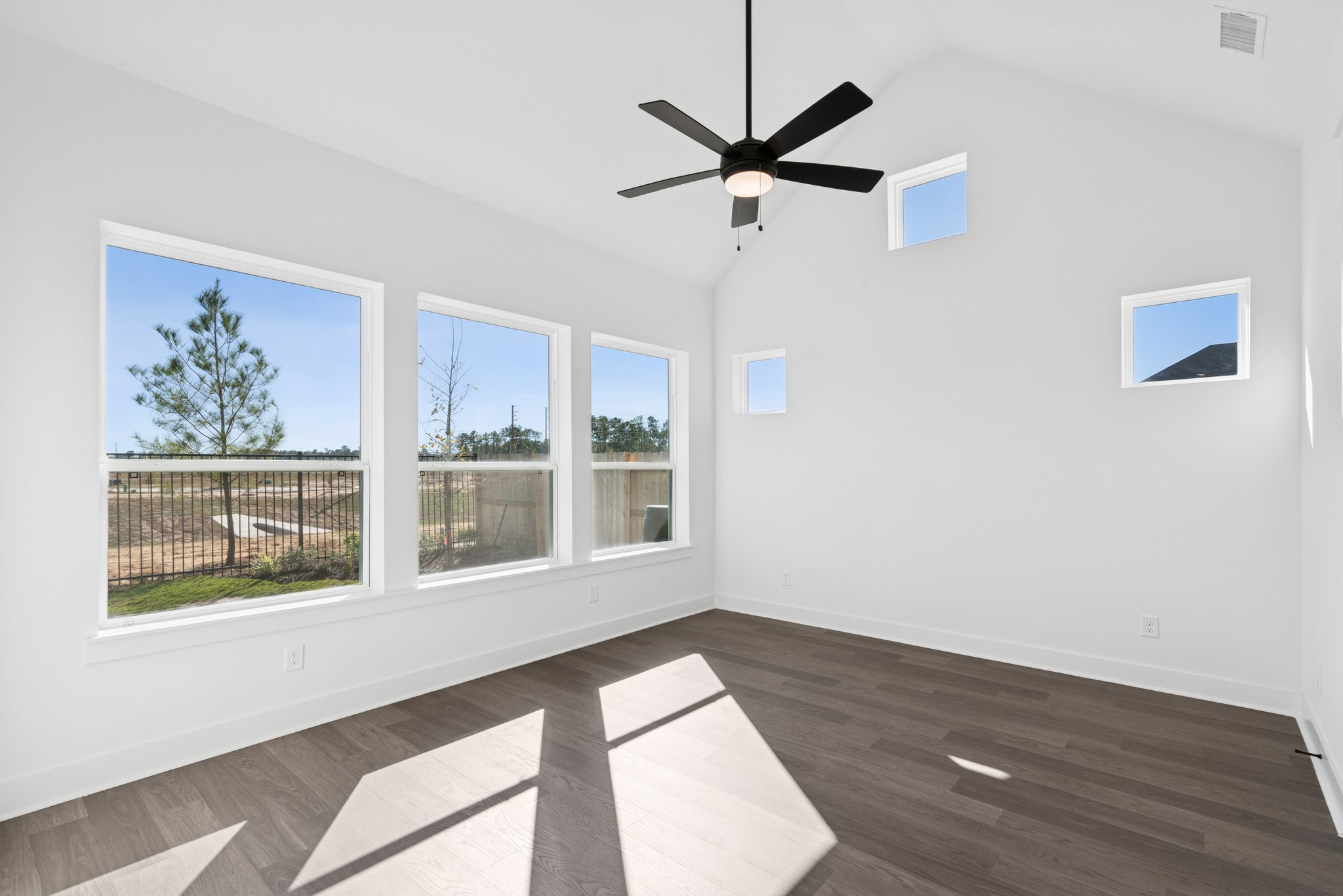 16138 Rita Road Conroe, TX 77302 - Photo 36 of 50 a view of empty room with wooden floor and fan