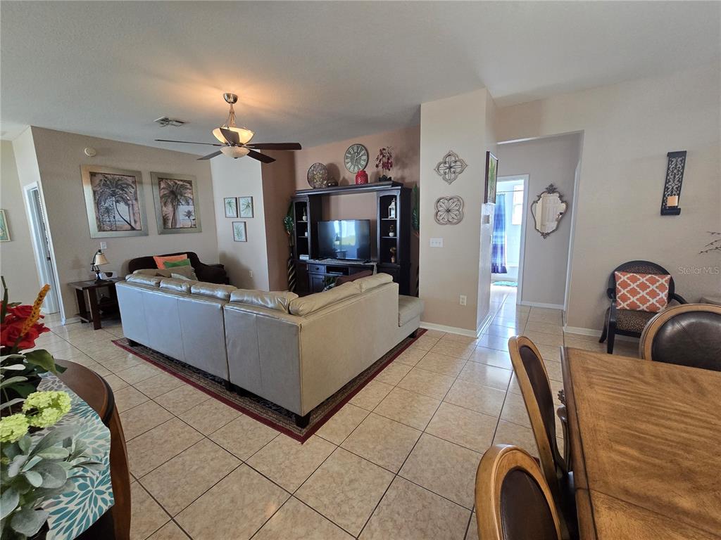 219 Cloverdale Road Winter Haven, FL 33884 - Photo 6 of 29 a living room with furniture and a flat screen tv