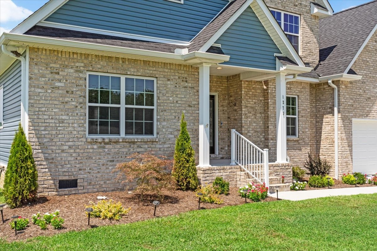 1273 Norton Road Manchester, TN 37355 - Photo 5 of 53 a front view of a house with garden