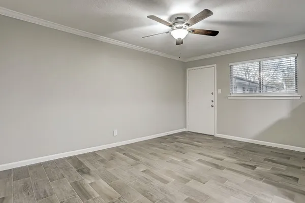 a view of an empty room with a window