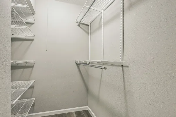 a bathroom with a window and a shower