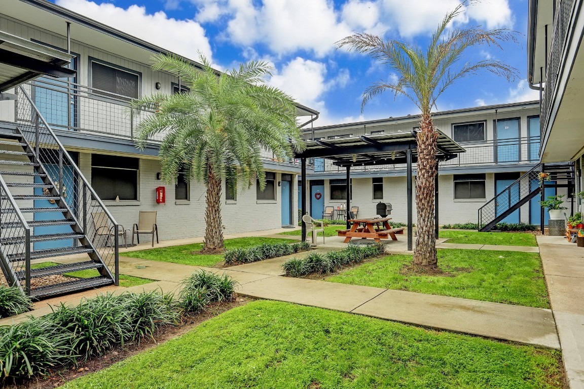 405 Hawthorne Street, Unit 22 Houston, TX 77006 - Photo 10 of 10 a view of a house with backyard porch and sitting area