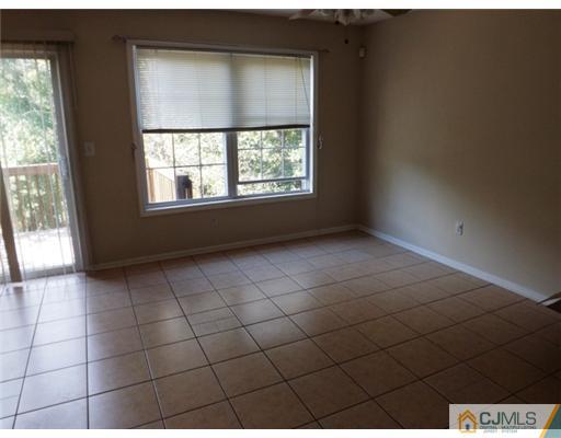 18 Lakeview Drive Helmetta, NJ 08828 - Photo 4 of 11 a view of an empty room with a window