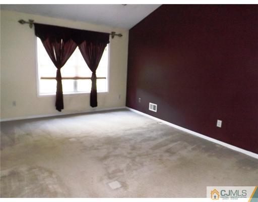 18 Lakeview Drive Helmetta, NJ 08828 - Photo 7 of 11 a view of an empty room with a window