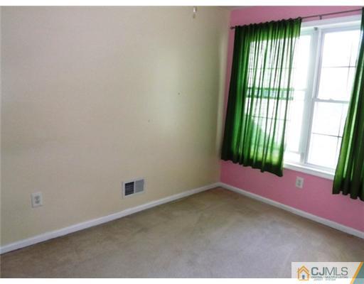18 Lakeview Drive Helmetta, NJ 08828 - Photo 8 of 11 an empty room with windows