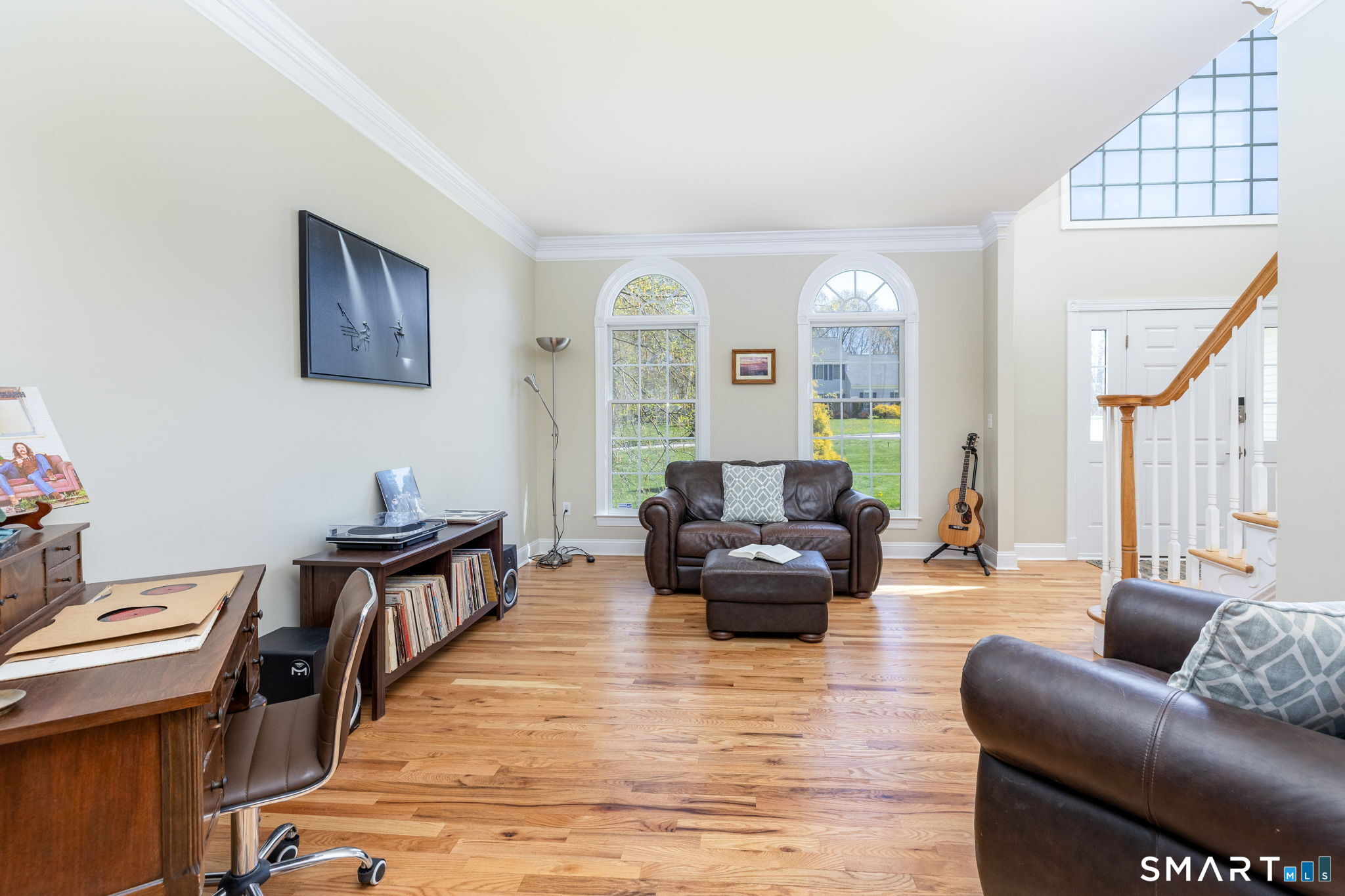 10 Eastham Bridge Road East Hampton, CT 06424 - Photo 8 of 37 The living room with architectural details like the arched windows and crown moldings