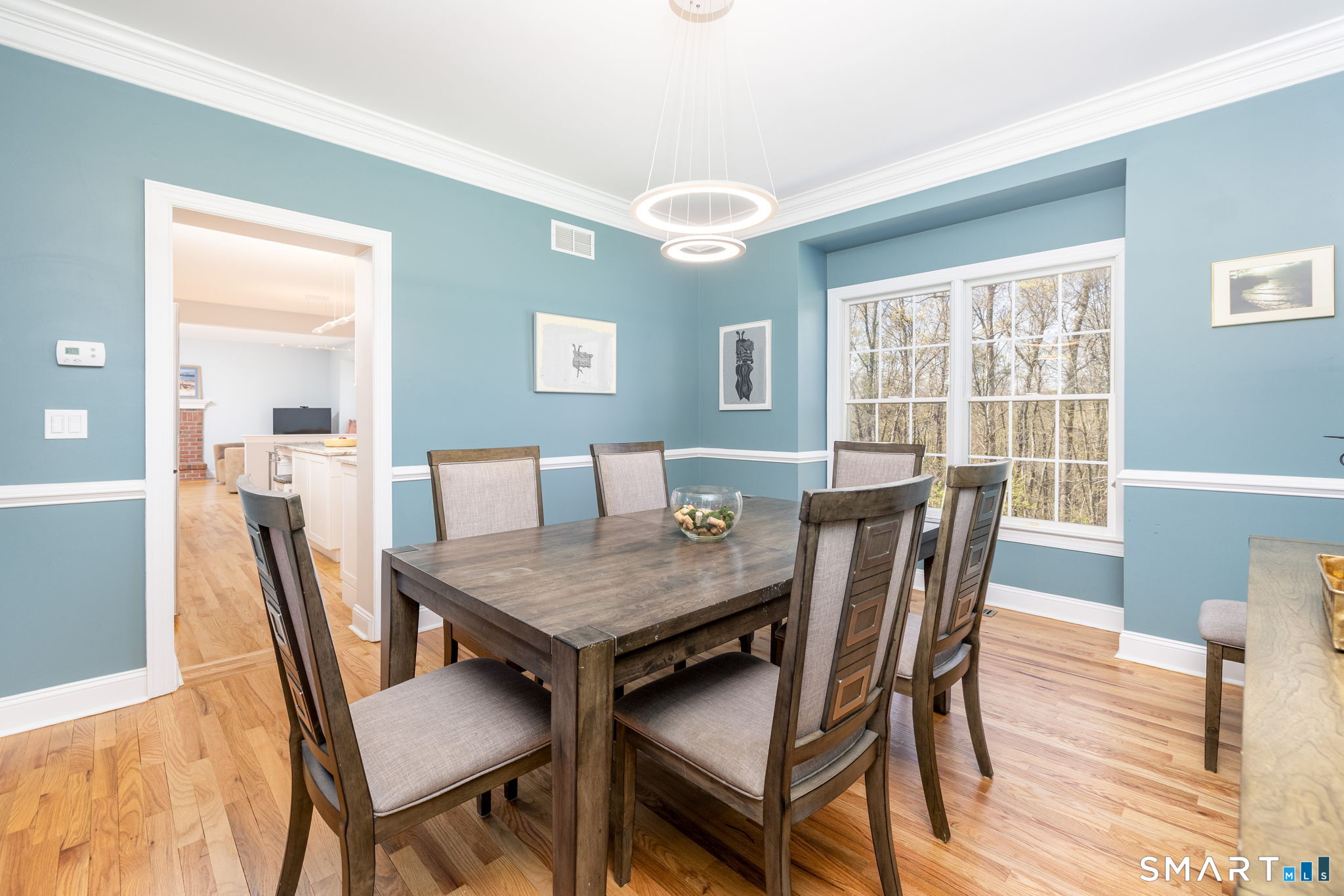 10 Eastham Bridge Road East Hampton, CT 06424 - Photo 10 of 37 The large dining room with crown moldings, and chair rail, opens to both the living room and the kitchen.