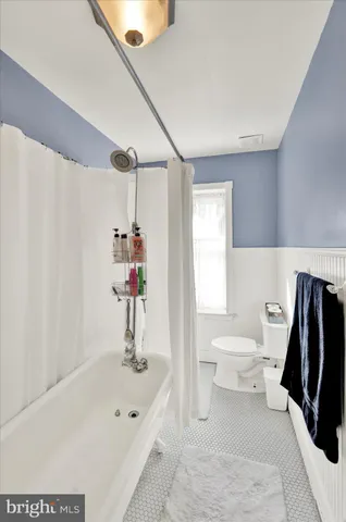 a bathroom with a sink a toilet and a bathtub